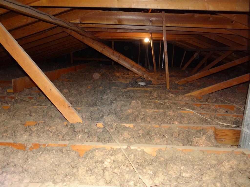 Attic insulation installation by GV Roofing