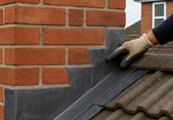 Roofing contractor repairing chimney leak and flashing on house in Kildare