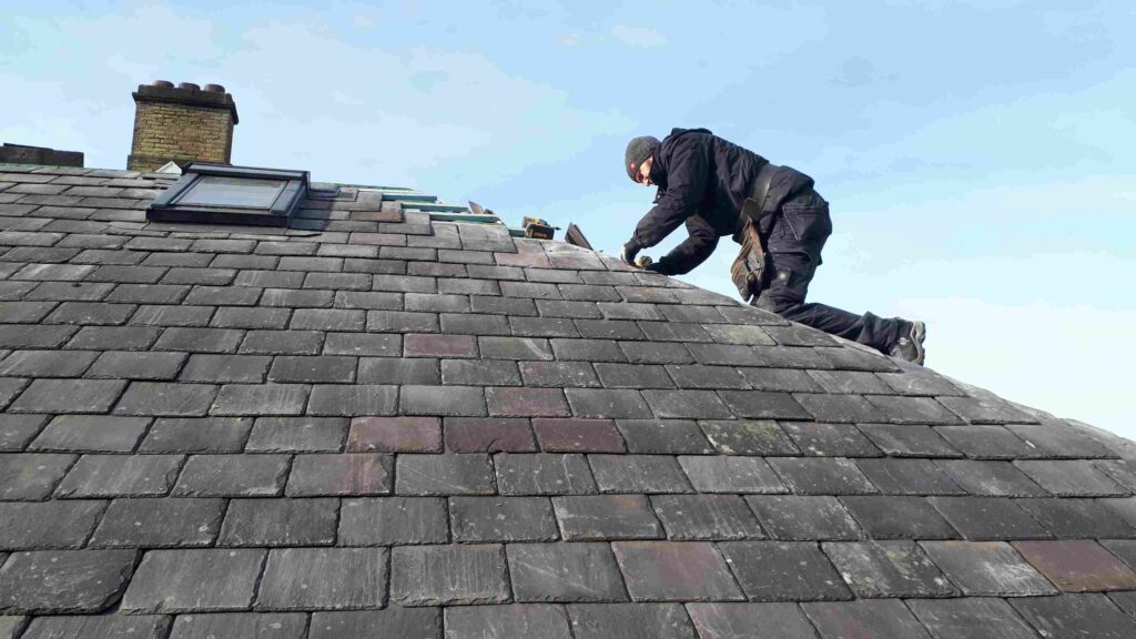 Professional slate roofing specialists repairing and installing slate roof in Kildare Ireland