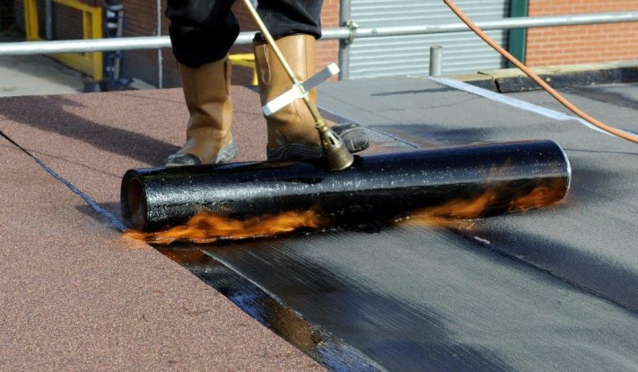 Professional torch on felt flat roof installation in Dublin Ireland by roofing contractors